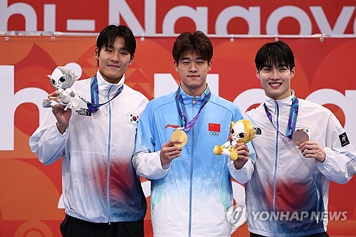 (Asiad) S. Korean swimmers seek to defend relay title; football teams set for inter-Korean clash
