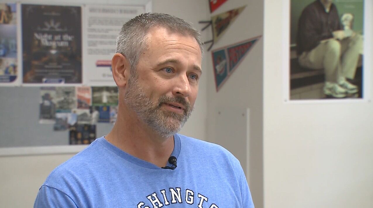 Teacher runs into burning house, crosses broken glass barefoot to save older neighbor