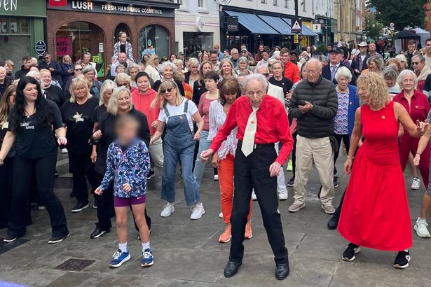Britain's oldest dancer, 100, leads huge flash mob crowd in Alzheimer's charity fundraiser