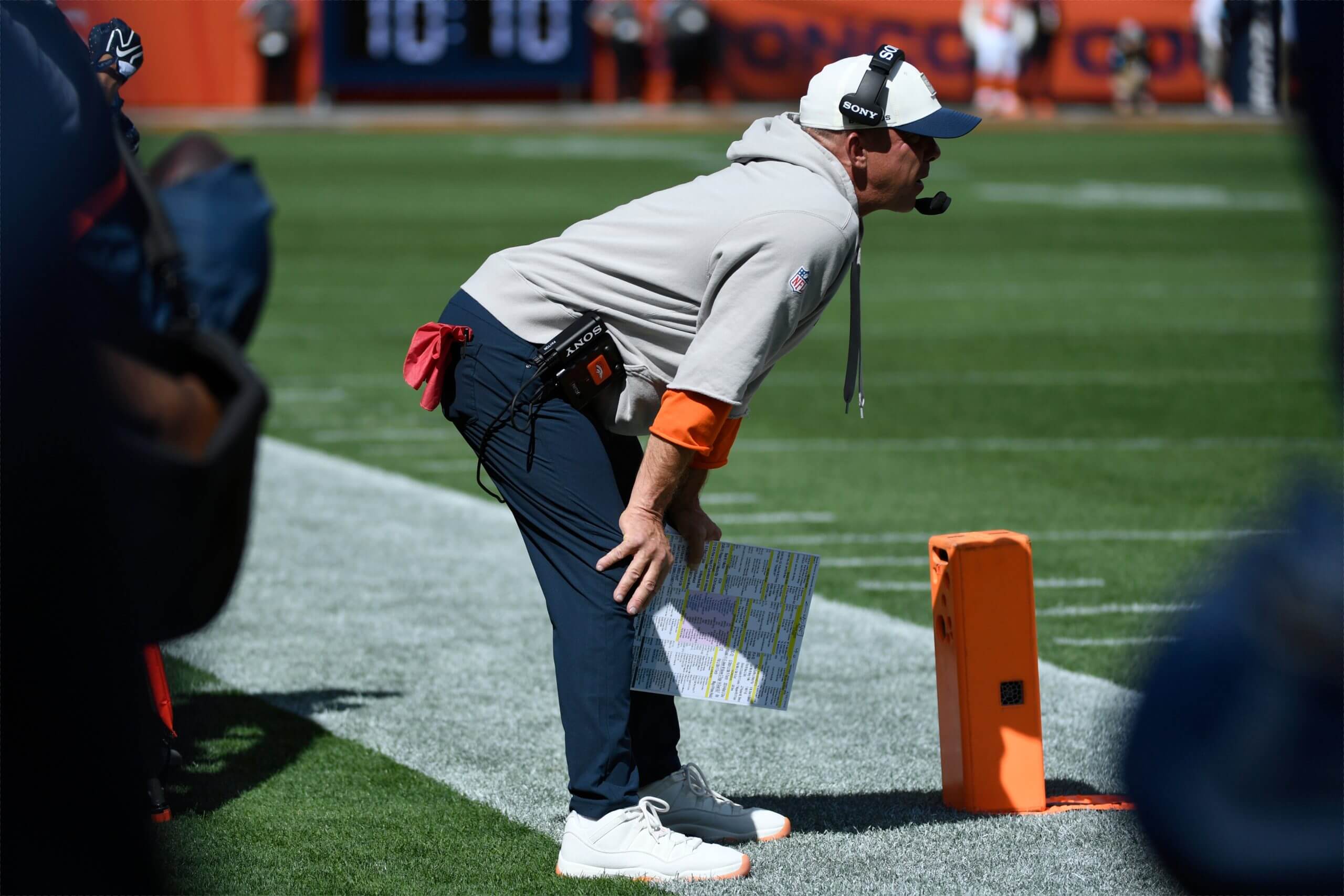 What's with Broncos' Sean Payton's crouching? It's not about anything on the field