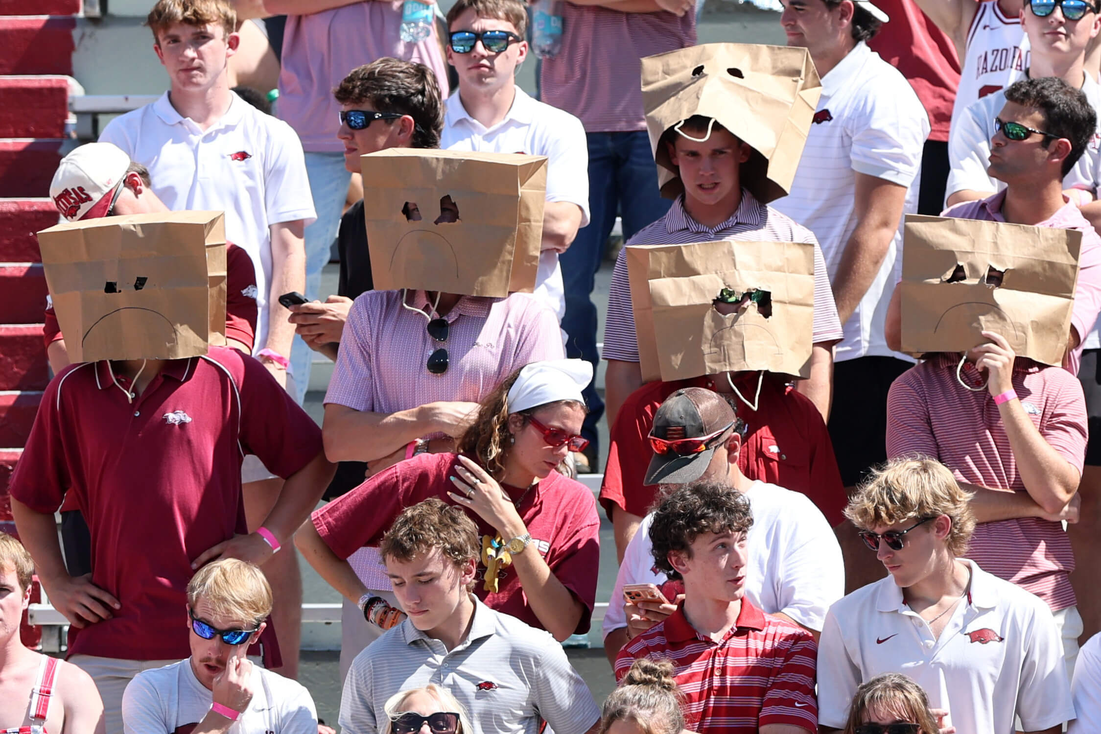 College sports fans have always been taken for granted. Now they're blamed for losing, too