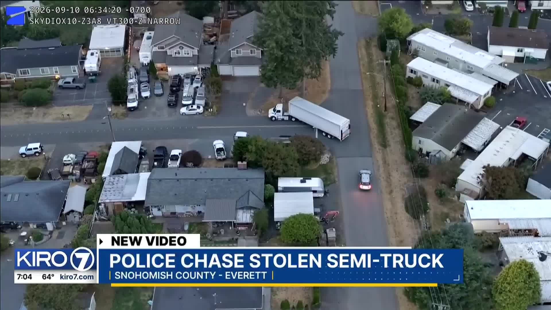Drone footage reveals semi-truck crash and suspect escape attempt