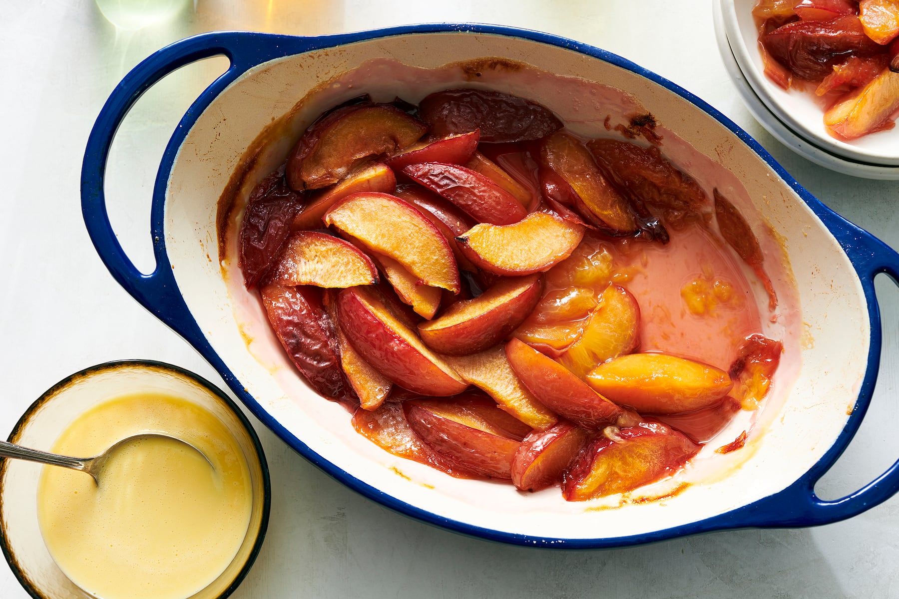 Roasted plums with coconut-cardamom cream