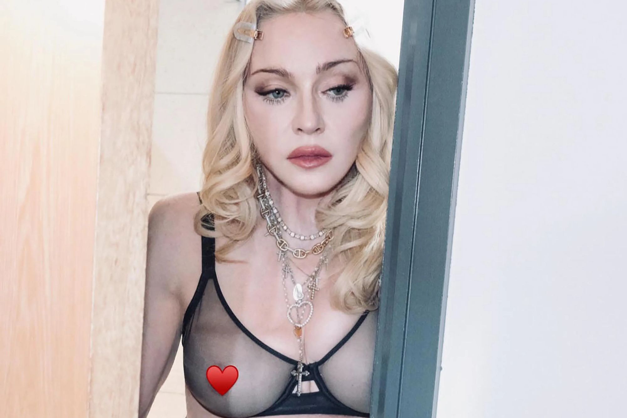 Madonna, 68, feels so free in just a see-through bra, underwear and tights as she drops new merch