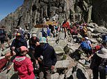 France bans day trippers from Mont Blanc trail in crack down on 'nose to tail' hikers who 'defecate in fields' and demand spas at mountain huts