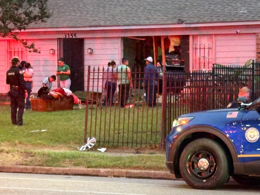 Child, two men injured after car crashes into house