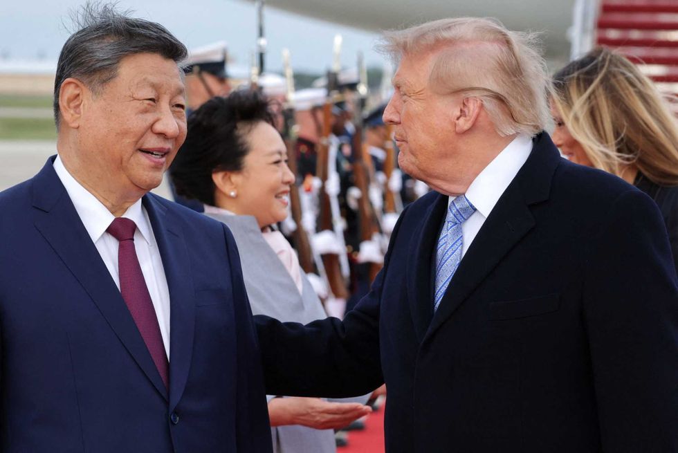 Alarm as Trump 'winces in pain' during military flyover: 'Global embarrassment'