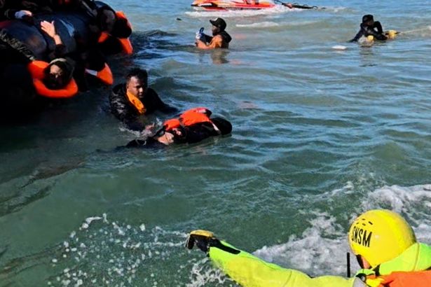 Moment young boy is plucked out of the English Channel during small boat rescue