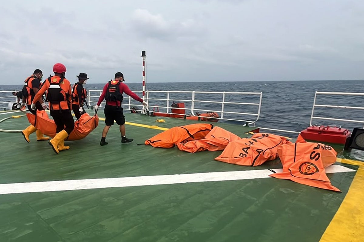Divers recover a total of 52 bodies from capsized ferry in Indonesia after a dayslong search