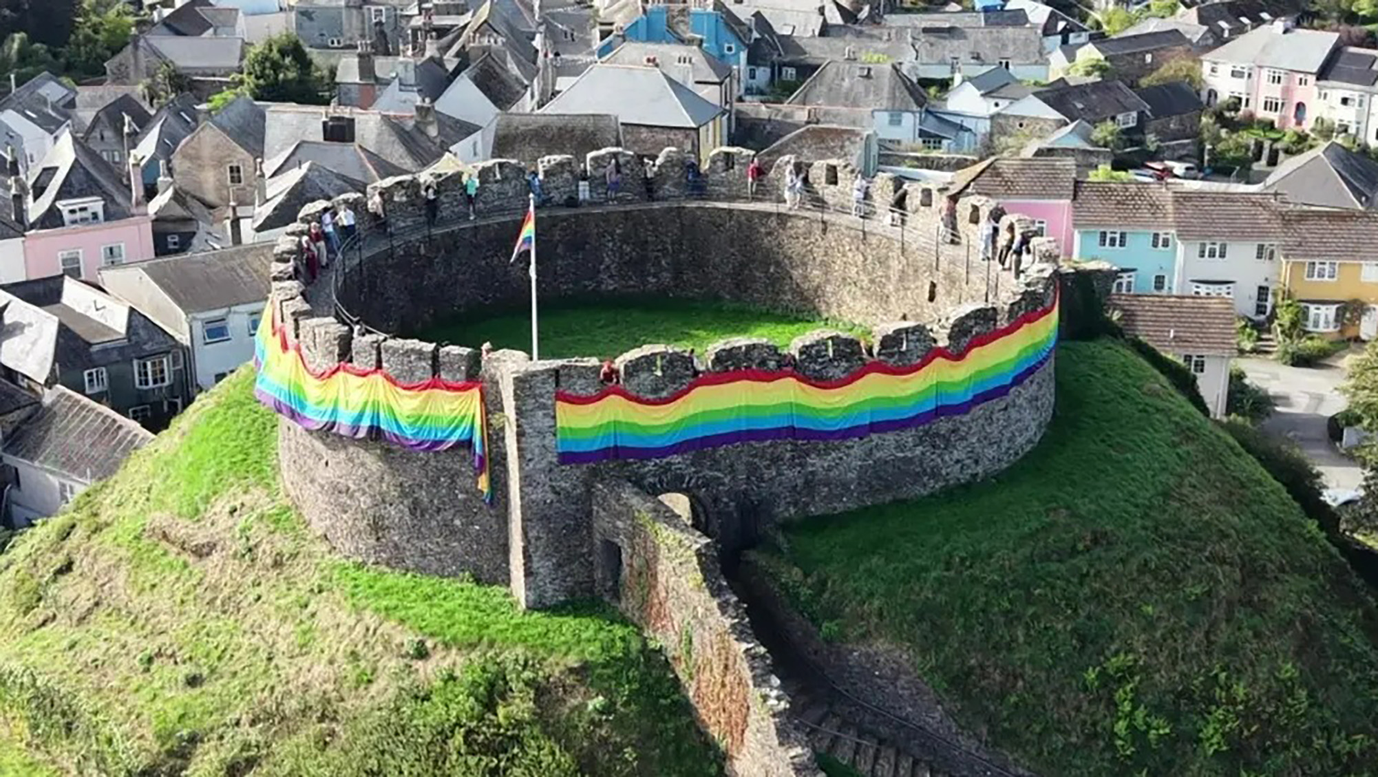 Rainbow pride flag wrapped around tourist castle sparks fury from residents as they blast: who paid for this?