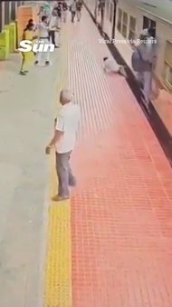 Station guard rescues passenger being dragged by moving train in India