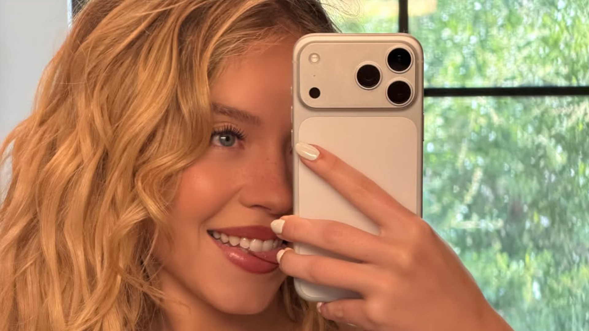 Sydney Sweeney takes selfies in a plunging black Syrn bra and thong as she sends secret message to boyfriend Scooter