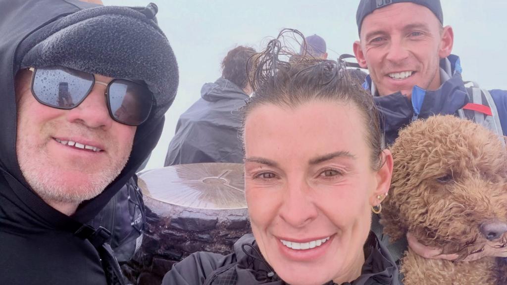 Wayne and Coleen Rooney climb Wales' highest mountain