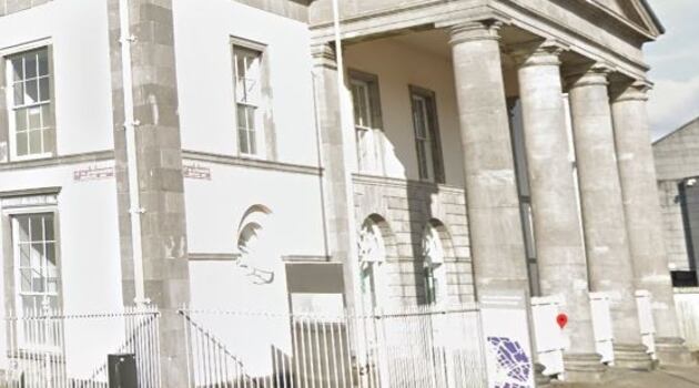 Man charged with child cruelty after child (2) found on roof ledge covered in faeces