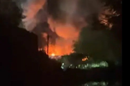 Huge blaze erupts on industrial estate with explosions heard & plumes of smoke seen for miles – as trains cancelled