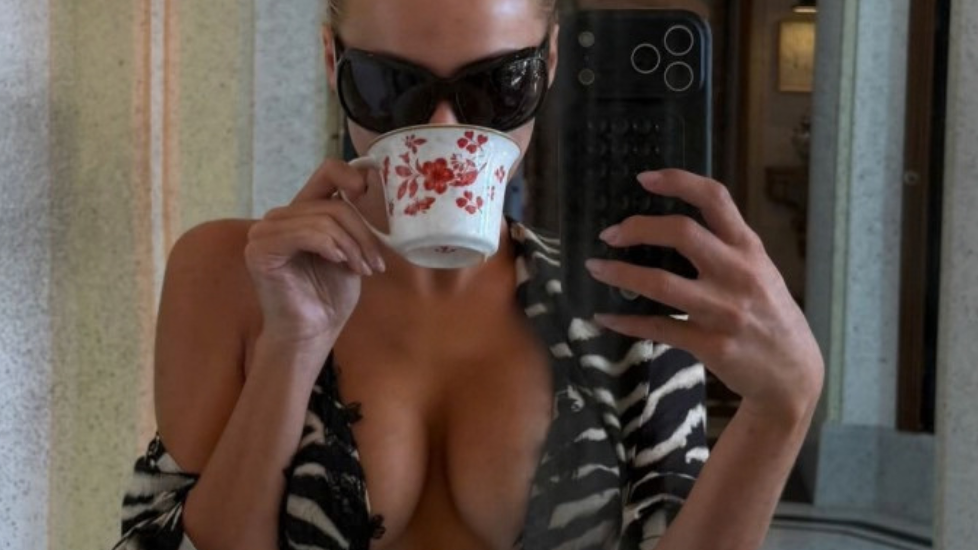 Brooks Nader pushes breasts together in zebra-print bikini as she shows off dreamy Portofino getaway