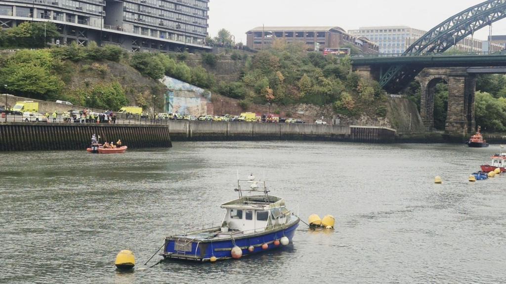 Car enters river prompting large emergency response