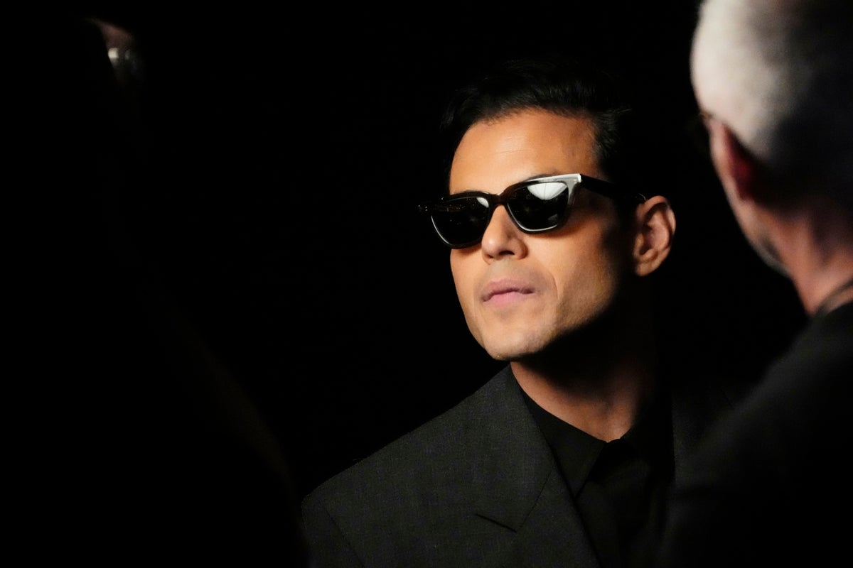Jerry Hall and Rami Malek watch as Saint Laurent goes for gold at Paris Fashion Week
