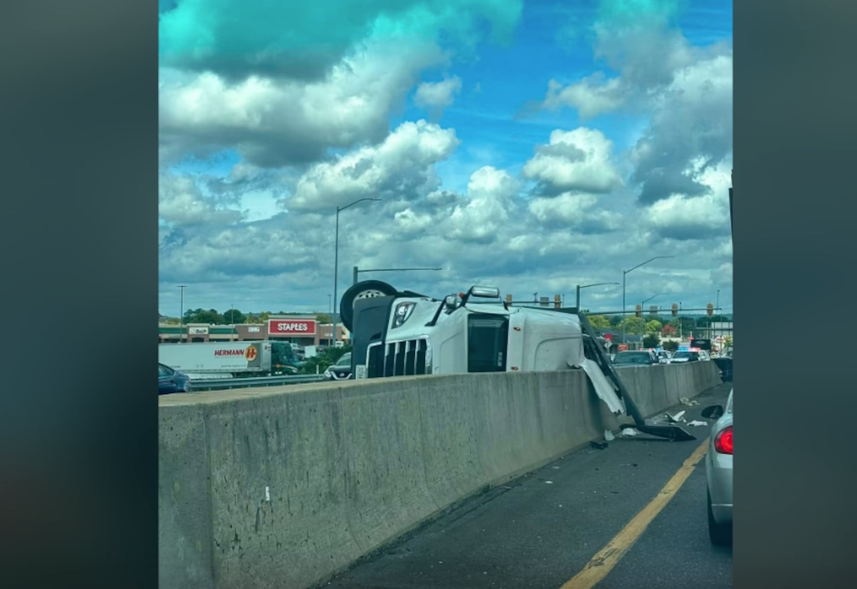 Truck flips on its side at busy Camp Hill intersection, causing traffic delays