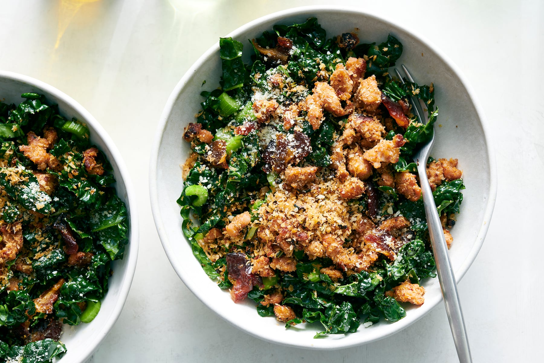Kale and date salad with crispy sausage bread crumbs