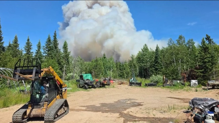 Officials downgrade evacuation warnings as crews suppress wildfires in northern Minnesota