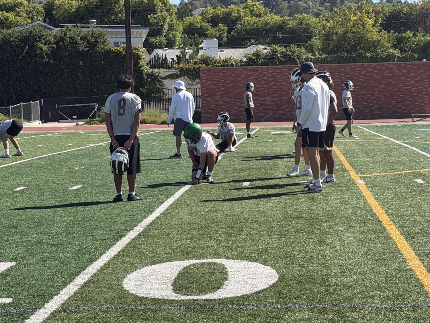 High school football players endure triple-digit temperatures on first day of practice