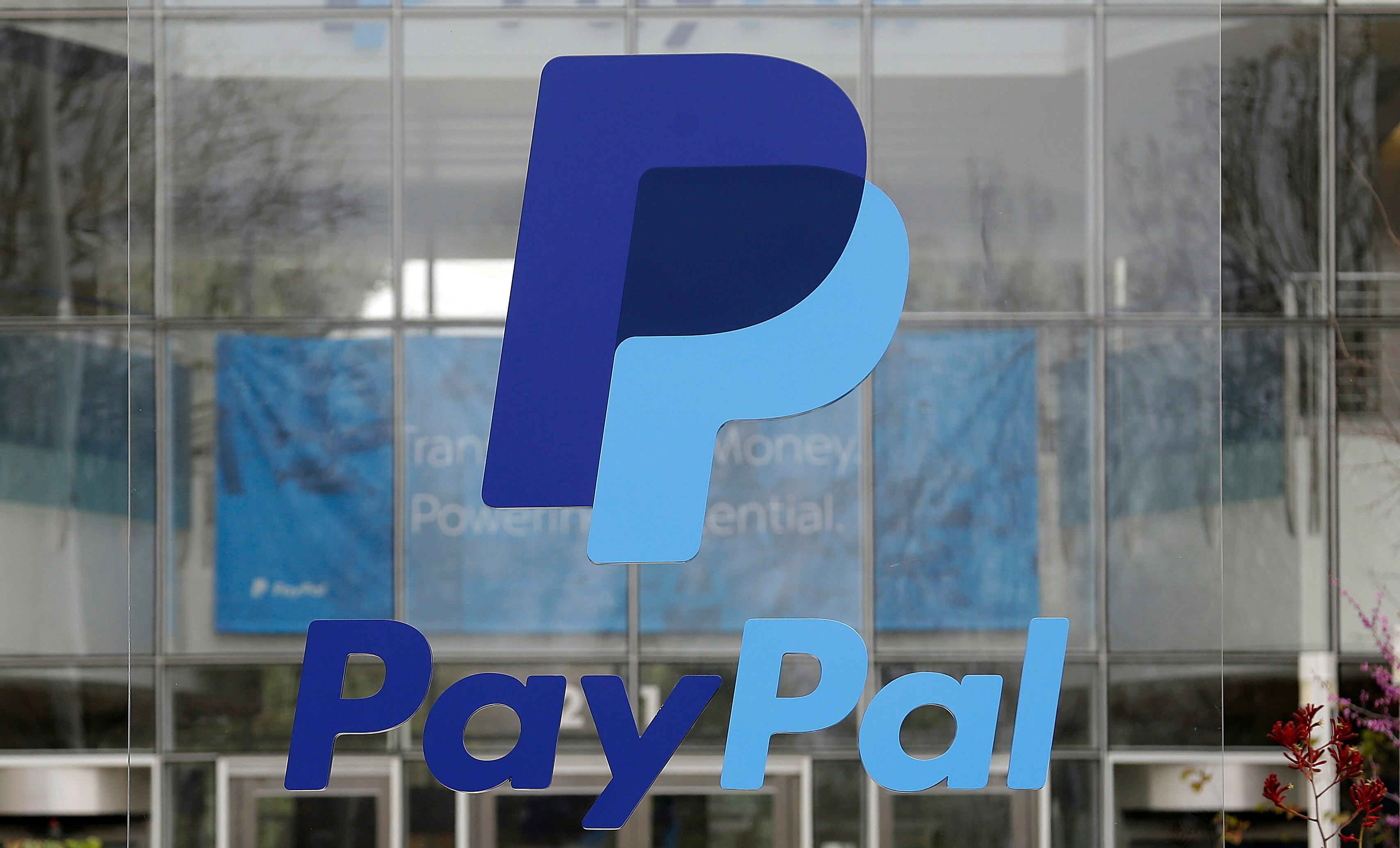 PayPal presses on with turnaround, raises outlook as it fends off takeover bid