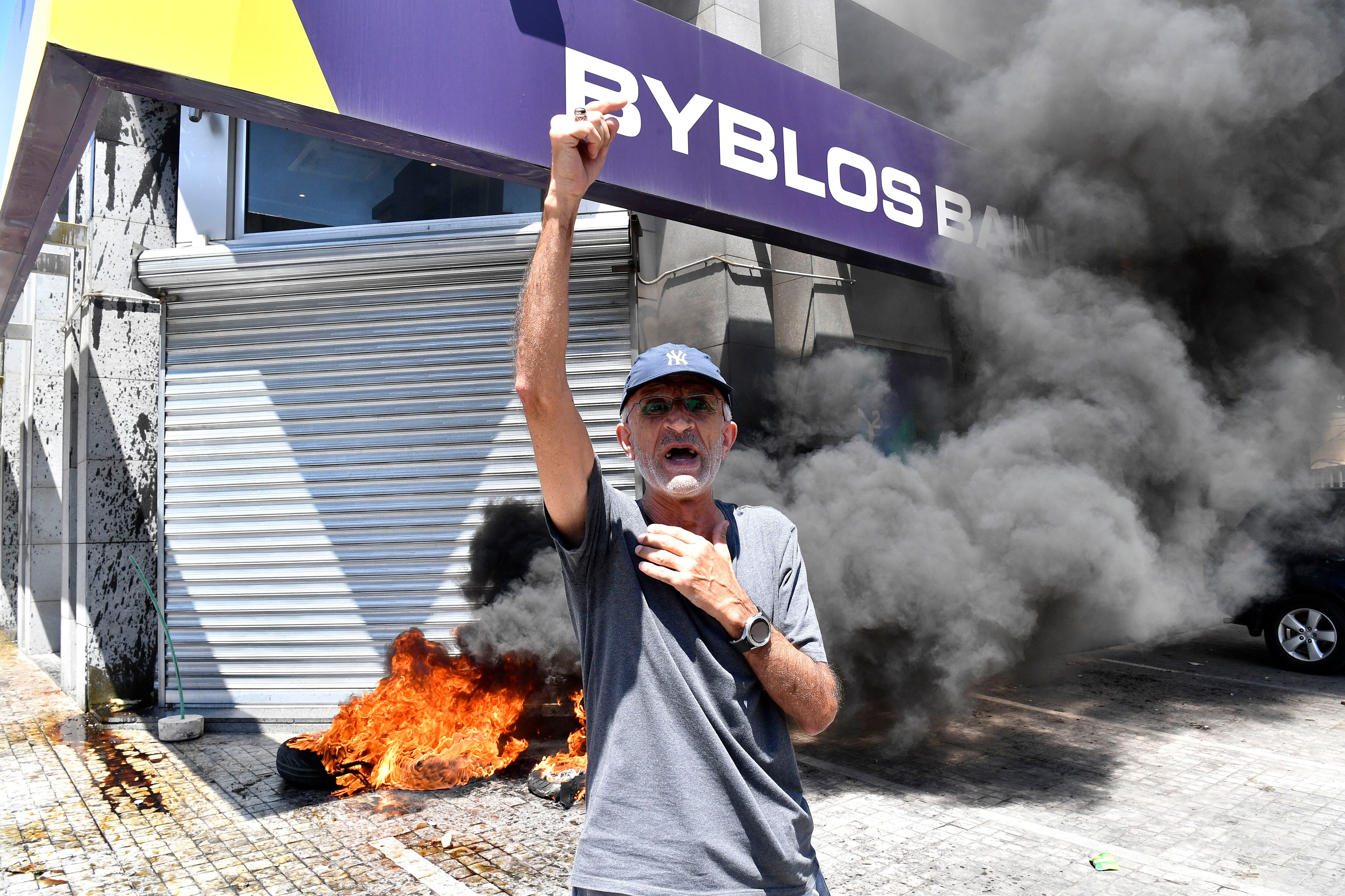 ‘Seven years is enough’: Protesters light fires at Lebanese banks over frozen savings