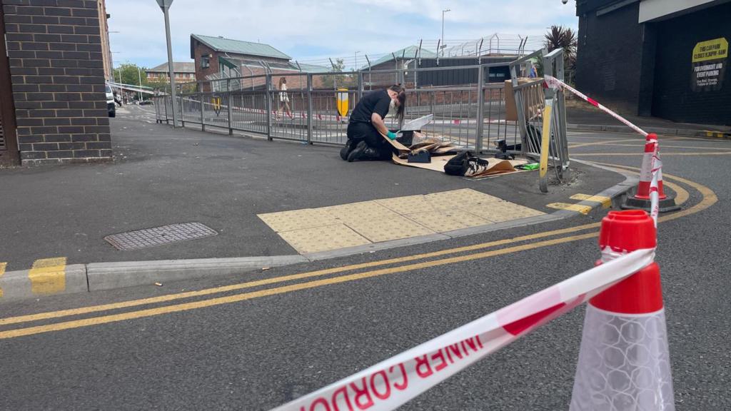 Three stabbed in flat before jumping out of window