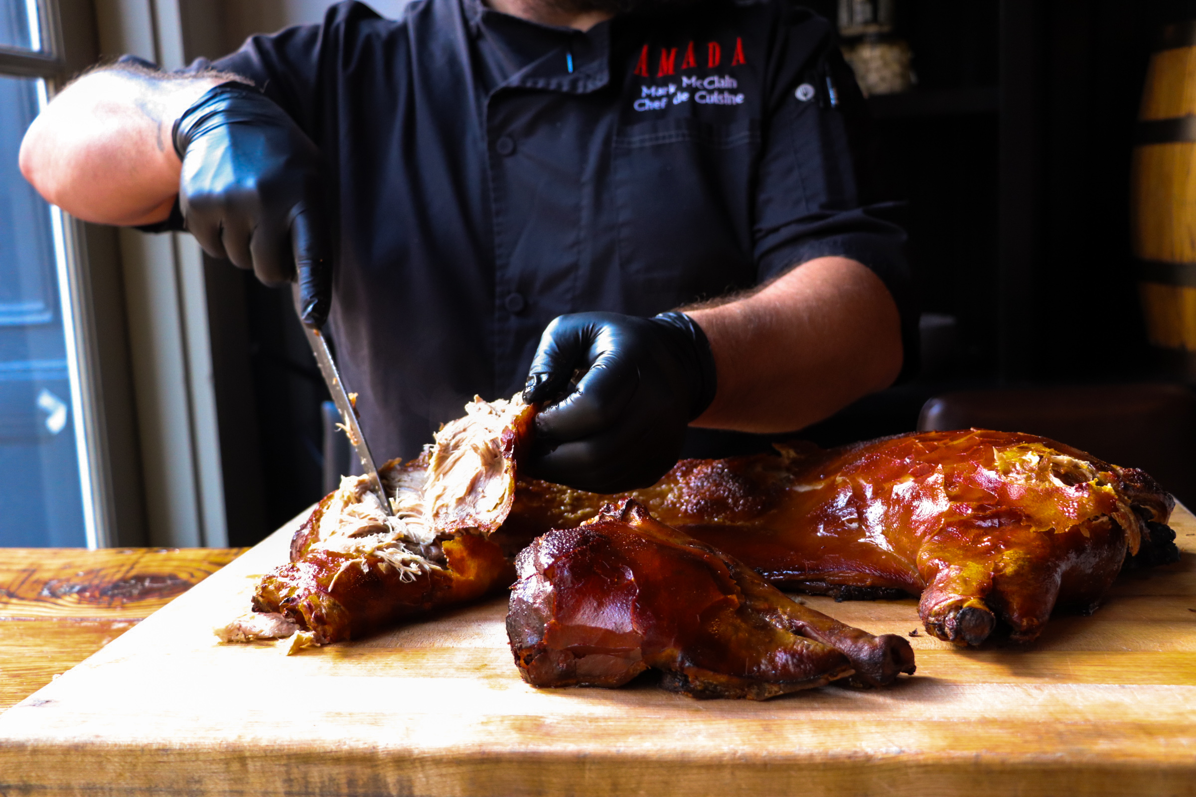 Amada's all-you-can-eat suckling pig dinner returns for two nights in August