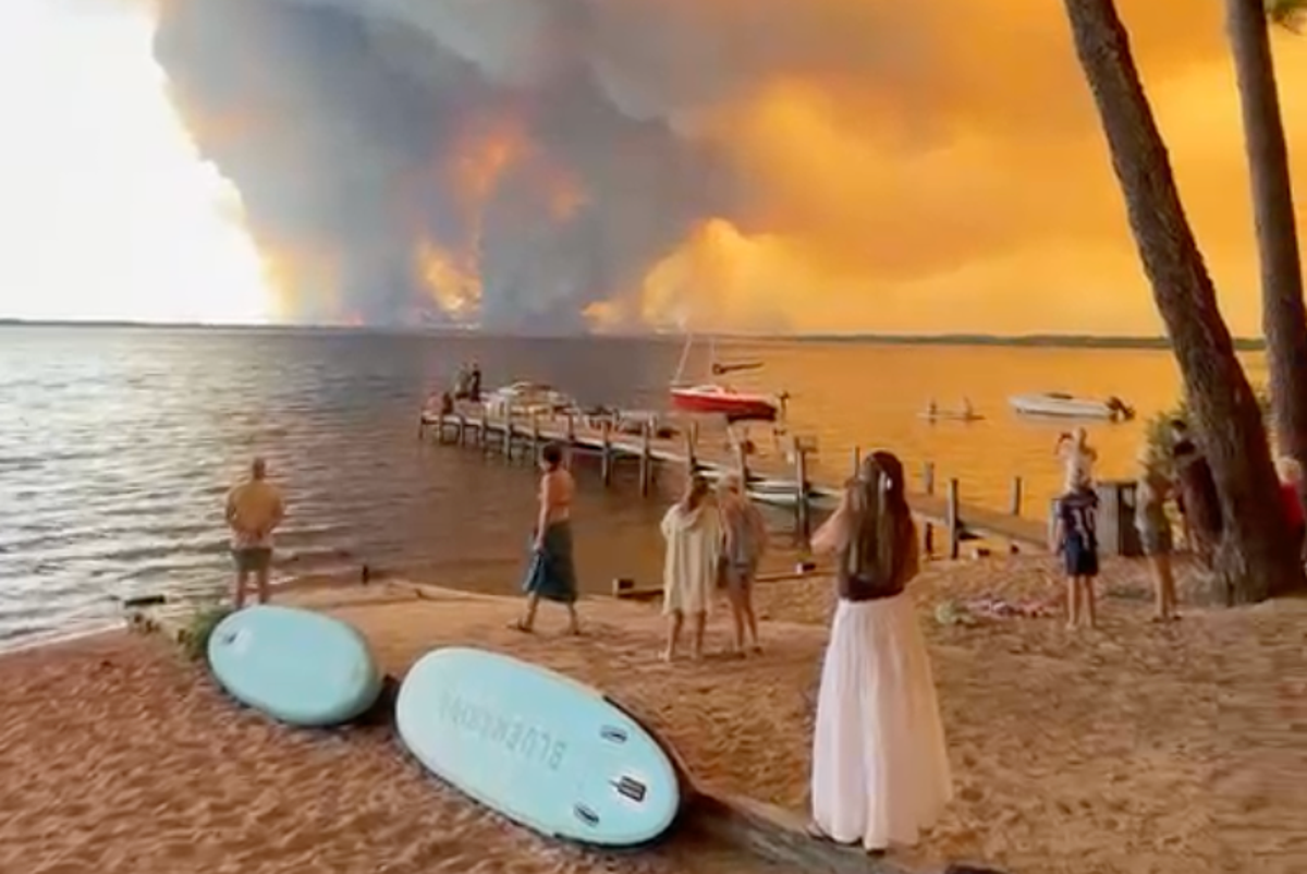 France wildfires turn skies apocalyptic orange as beachgoers watch on