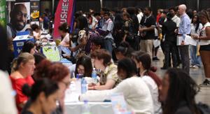 Hundreds of job seekers crowd the Enercare Centre for a chance to work at this summer’s CNE