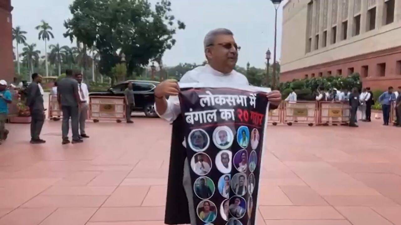 TMC's Kalyan Banerjee wears poster with 20 rebel MPs' photos in Parliament