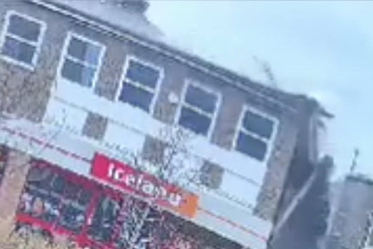 Roof of popular supermarket collapses as debris falls down onto busy street