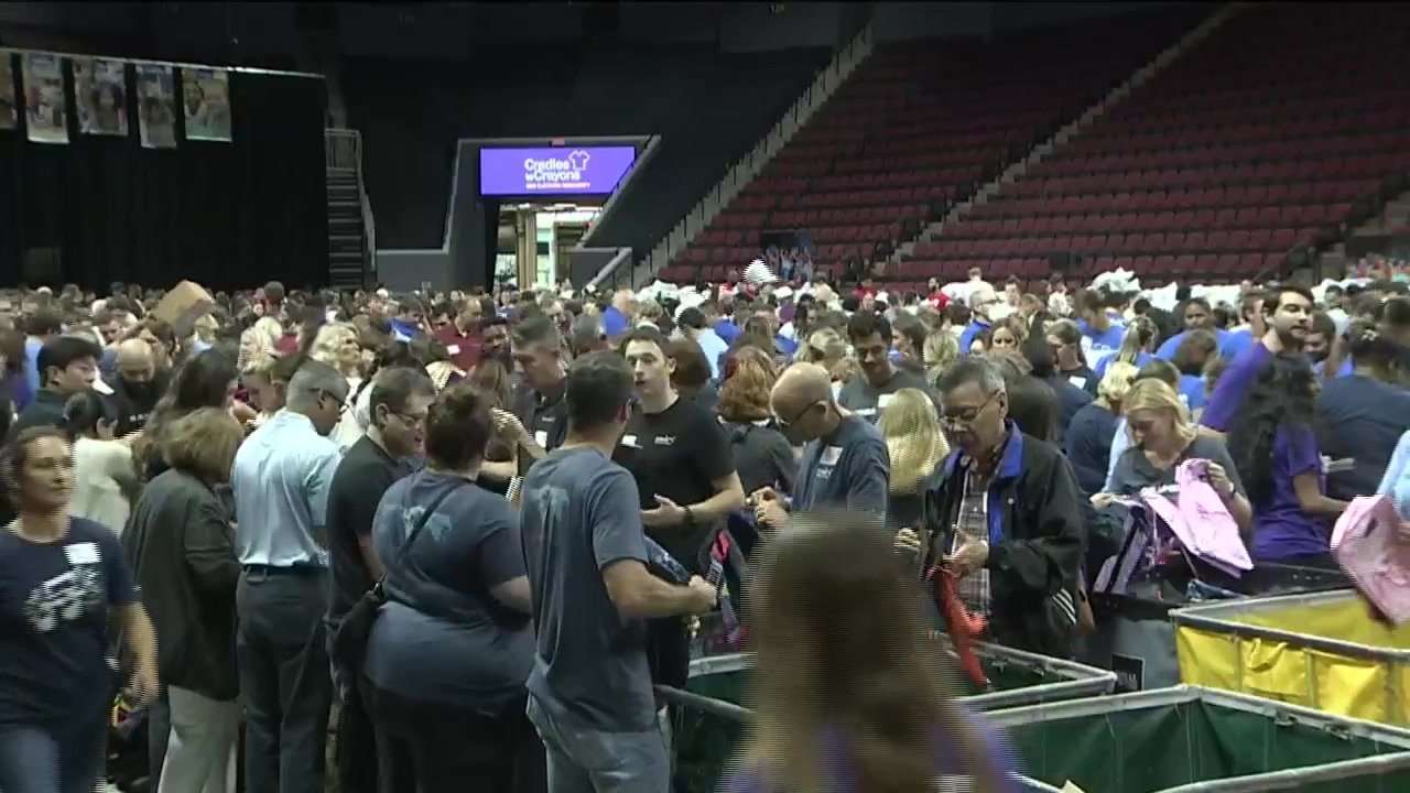 Hundreds of volunteers assemble school backpacks for Cradles to Crayons annual Backpack-A-Thon