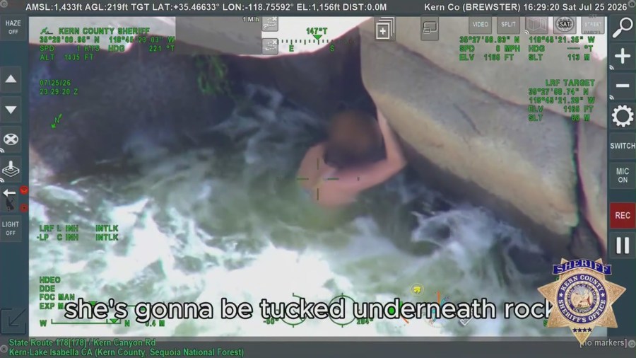 Woman found clinging to underside of rock in dramatic California river rescue