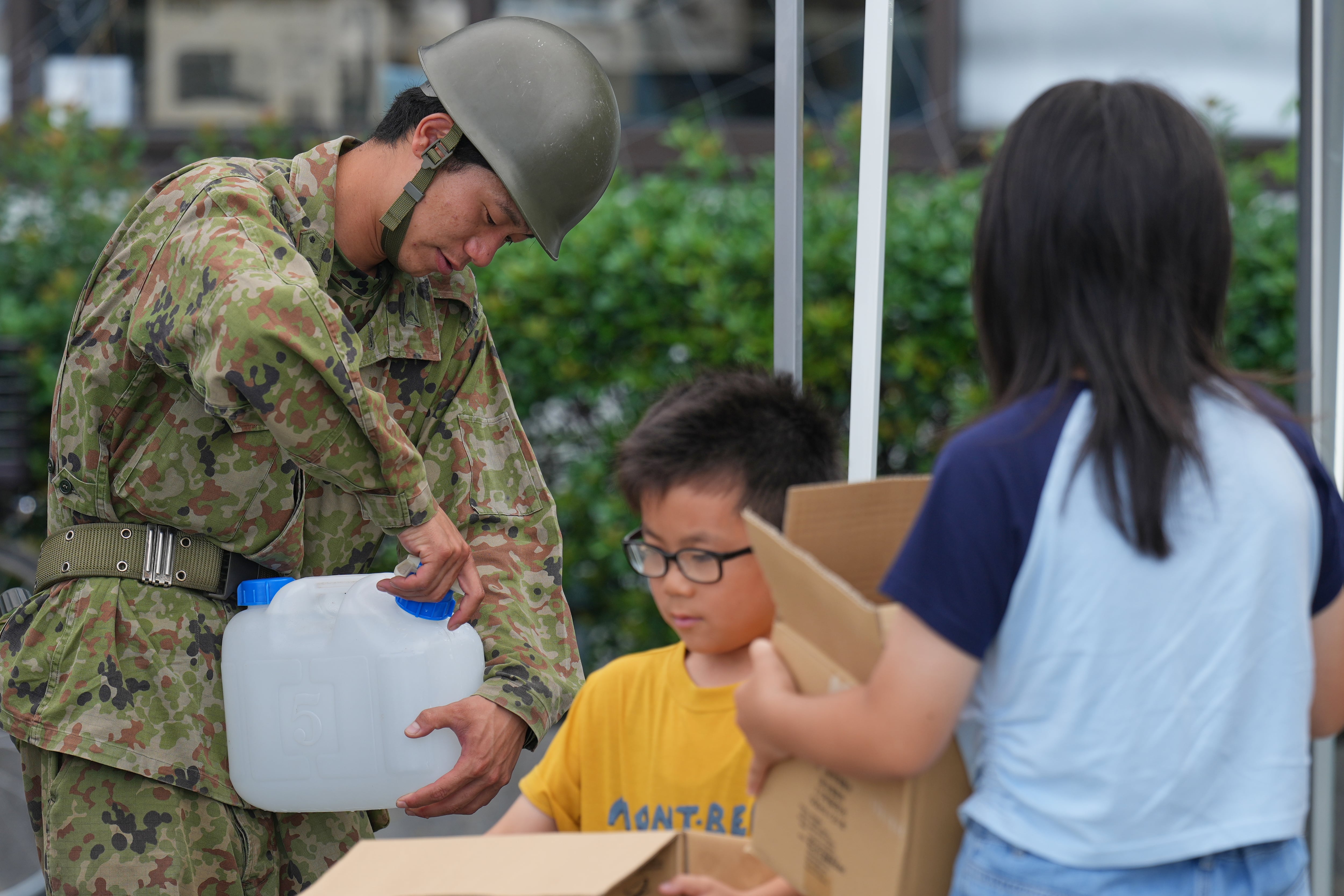 Quake survivors in southwestern Japan sleep in cars in sweltering heat as death toll rises to 34