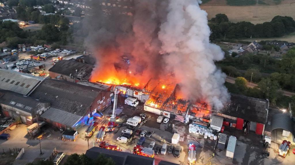 People warned to keep windows shut after huge trading estate fire