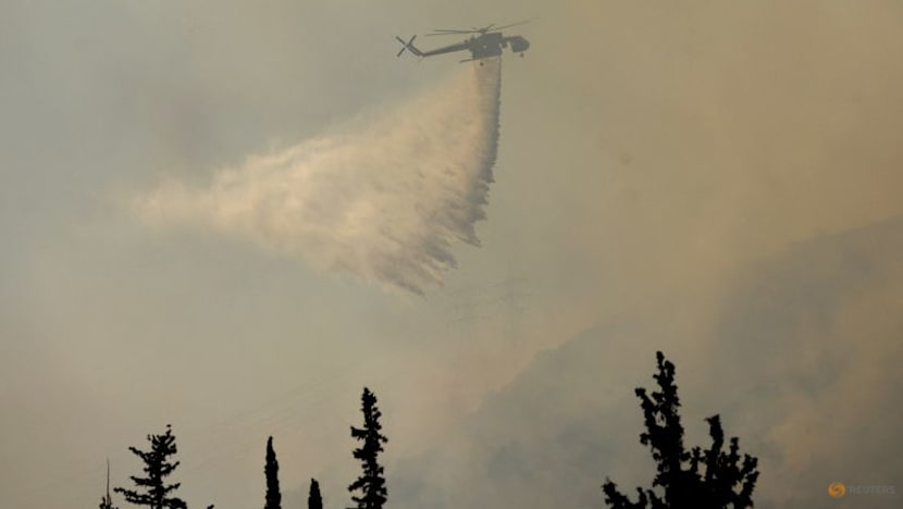 Firefighters in Greece struggle to save coastal resort as winds rage