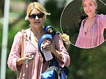 Holly Willoughby poses in a bikini with a chic cover-up and wishes followers a 'Happy Sunday' as she steps out in Portugal - days after critics' takedown of her 'dire and banal' YouTube debut