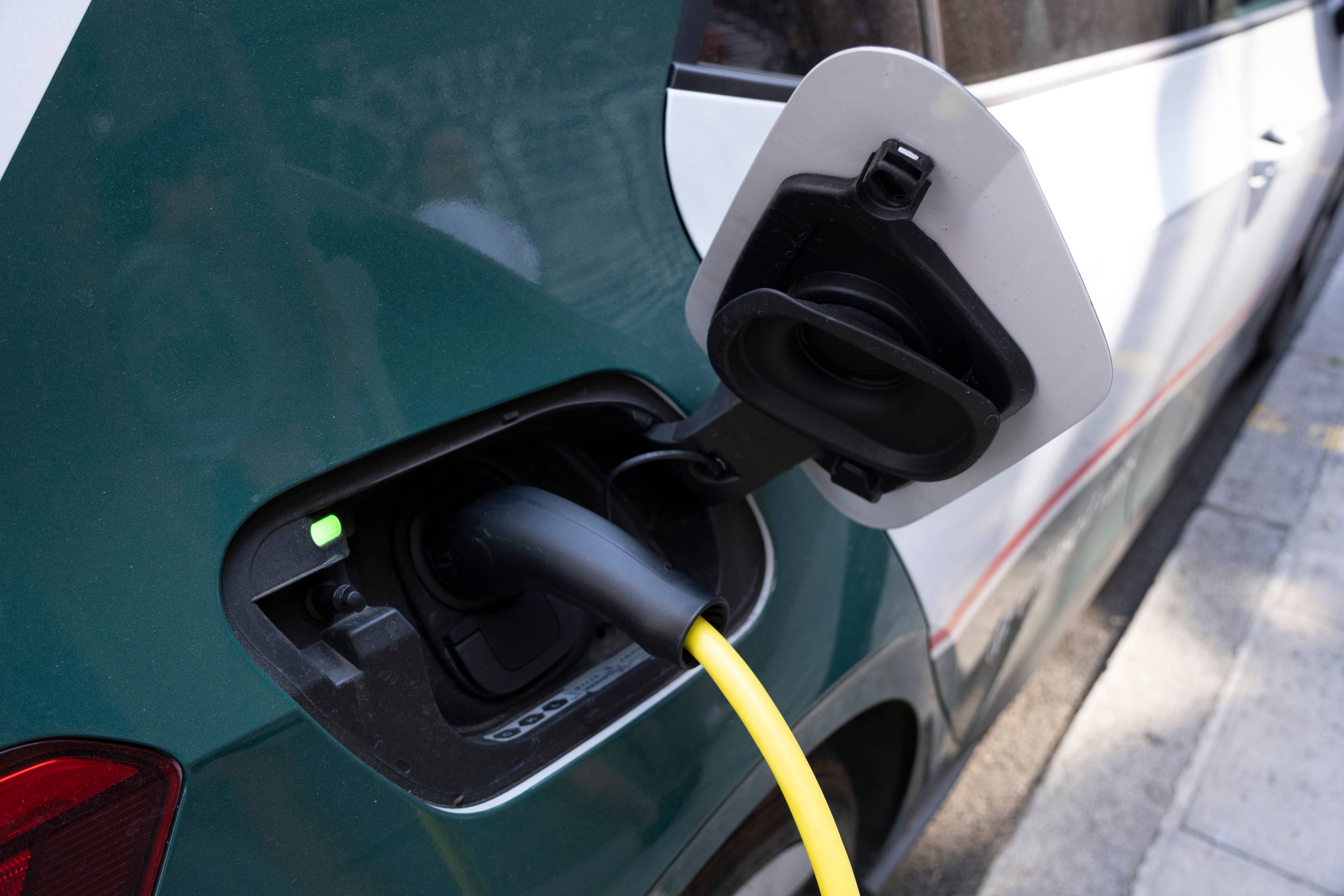 Tesla rival trims spending plans despite revenue beat