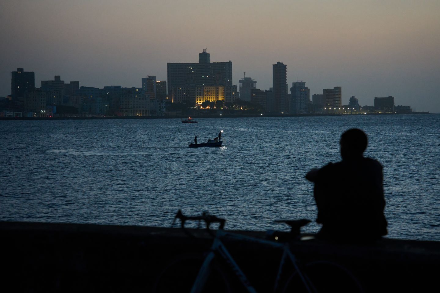 Cubans sleep on seaside boardwalk to seek relief from crippling blackouts and summer heat