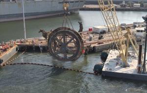 Crane that collapsed off dock at former Navy Base now removed
