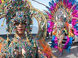 Rihanna displays her curves and goes braless in daring bejewelled outfit and feathered headdress as she makes her return to famous Bajan carnival