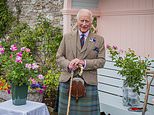 Beaming King Charles poses in a tartan kilt as he plants rose named in his honour at Queen Mother's former home before starting his annual Scottish summer break