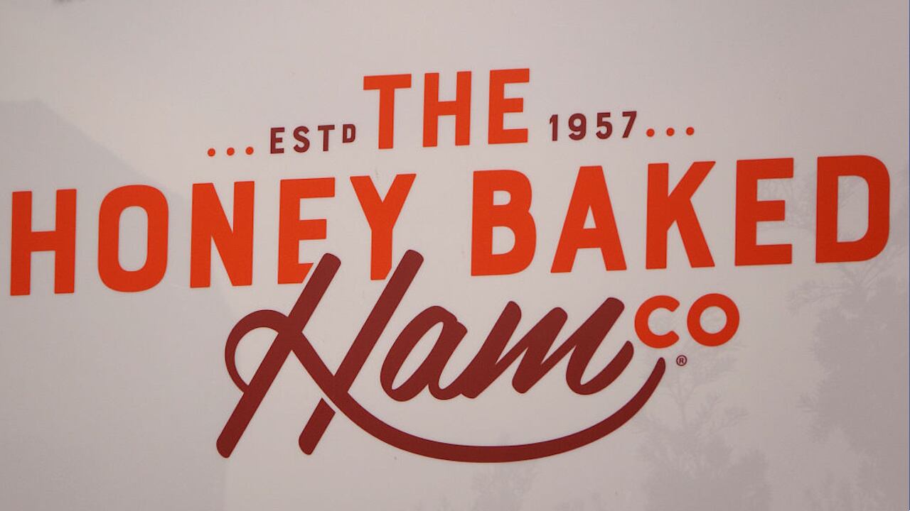 Police officer injured when SUV crashes into Honey Baked Ham seasonal store