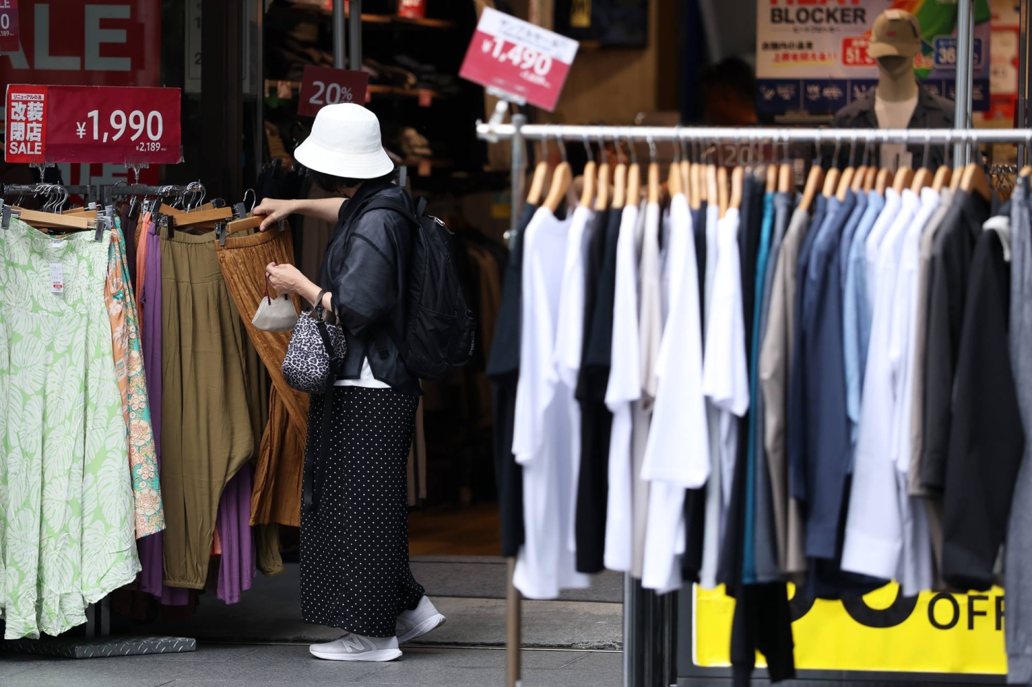 Japan’s households continue to cut spending amid persistent inflation