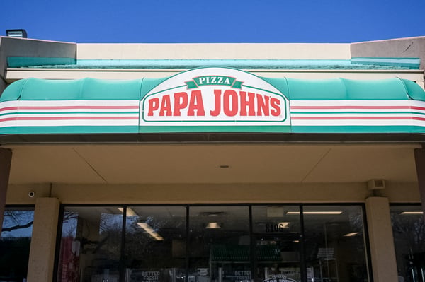 Papa Johns slashed its outlook and suspended its dividend as U.S. sales kept sliding