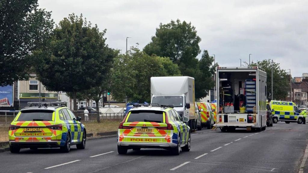 Man charged after four killed in lamp-post crash