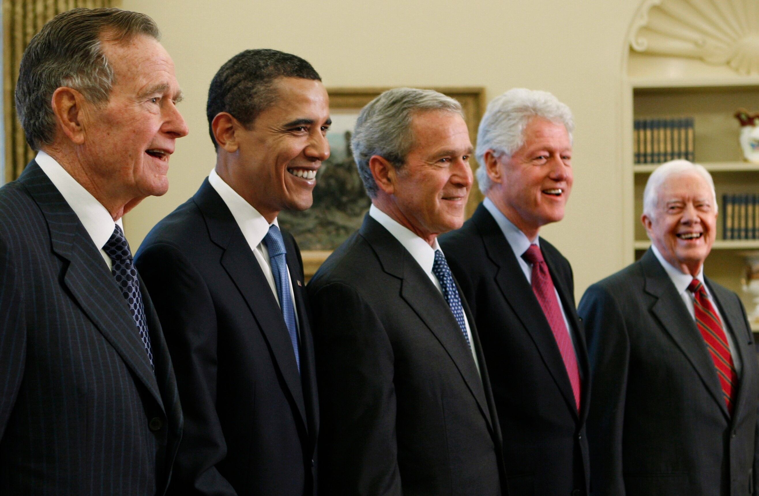 Trump goes unmentioned but not ignored as Clinton, Bush, and Obama step up as essayists on presidents